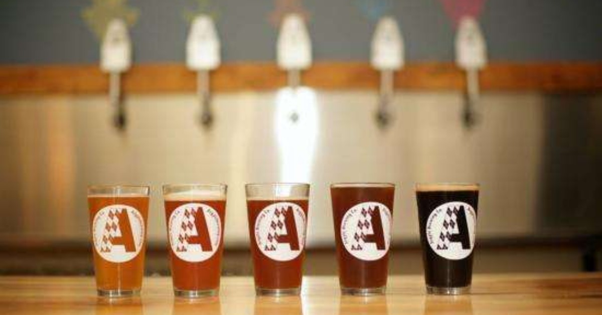 glasses of beer lined up lightest to darkest