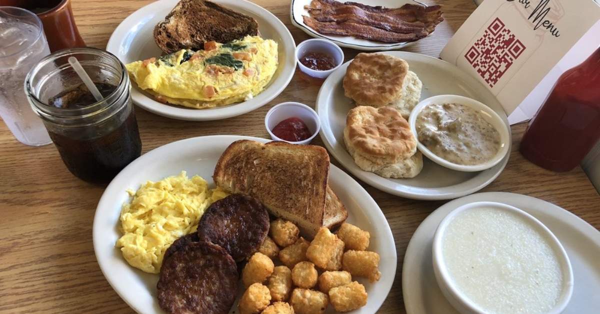 an array of plates with breakfast food on them