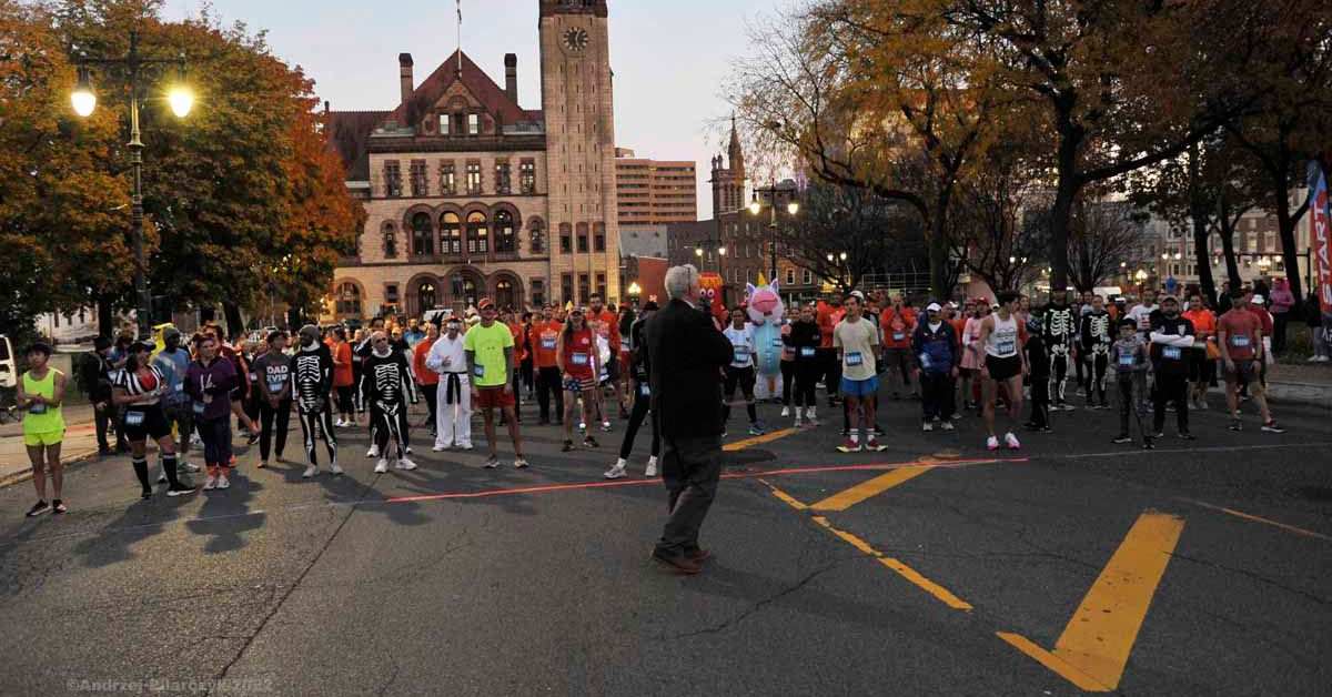 people in costumes lined up at the start of a race