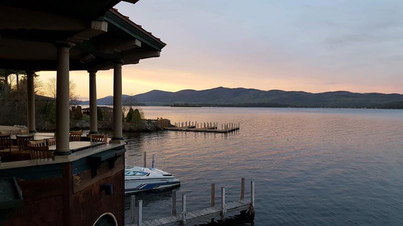 View of sunset and the Adirondack mountains from The Boathouse Restaurant on Lake George