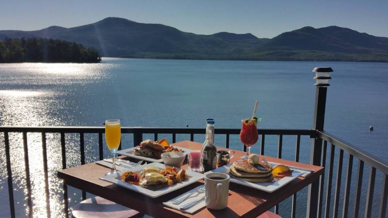 brunch on deck with view of Lake George