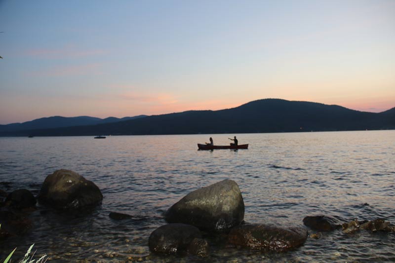 Canoers near Diamond Point on Lake George at dusk