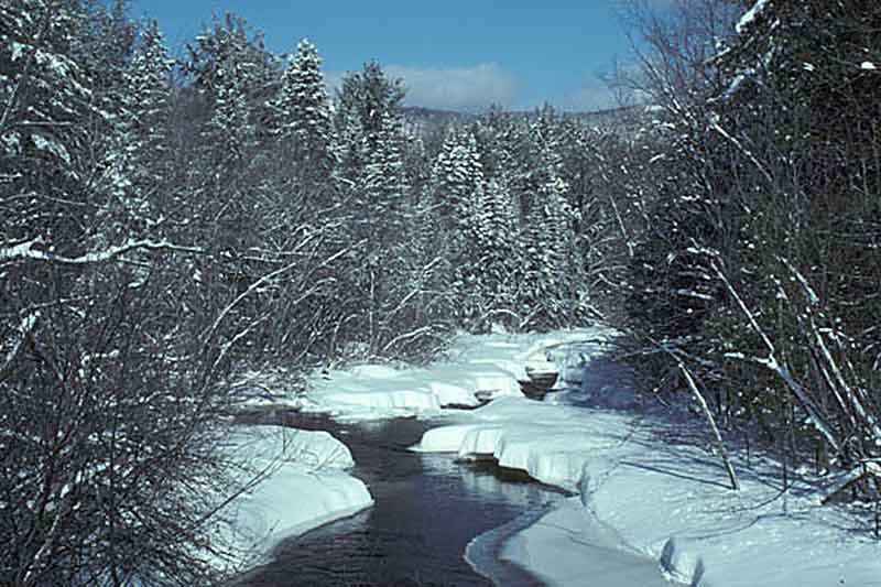 Snow covered creek in Minerva NY
