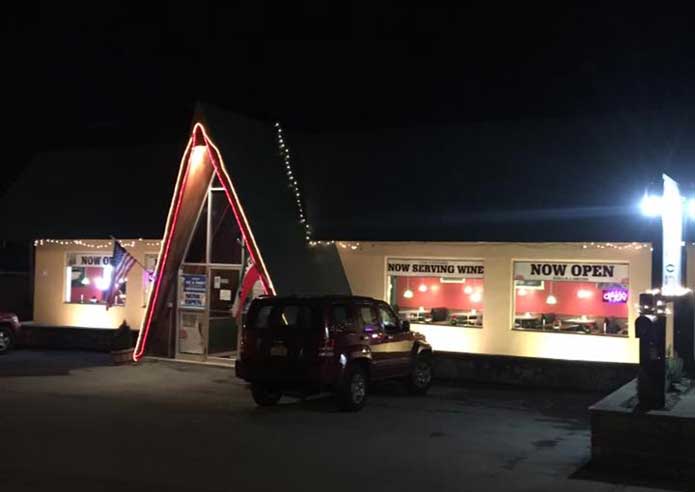 Exterior view of Number One Pizza at night
