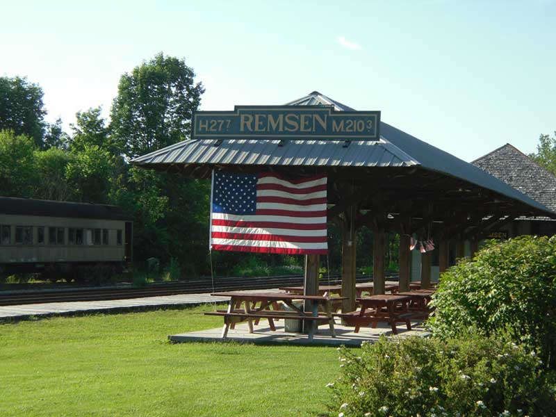 American Flag hung from rafters of a picnic area at the Remsen Train Depot
