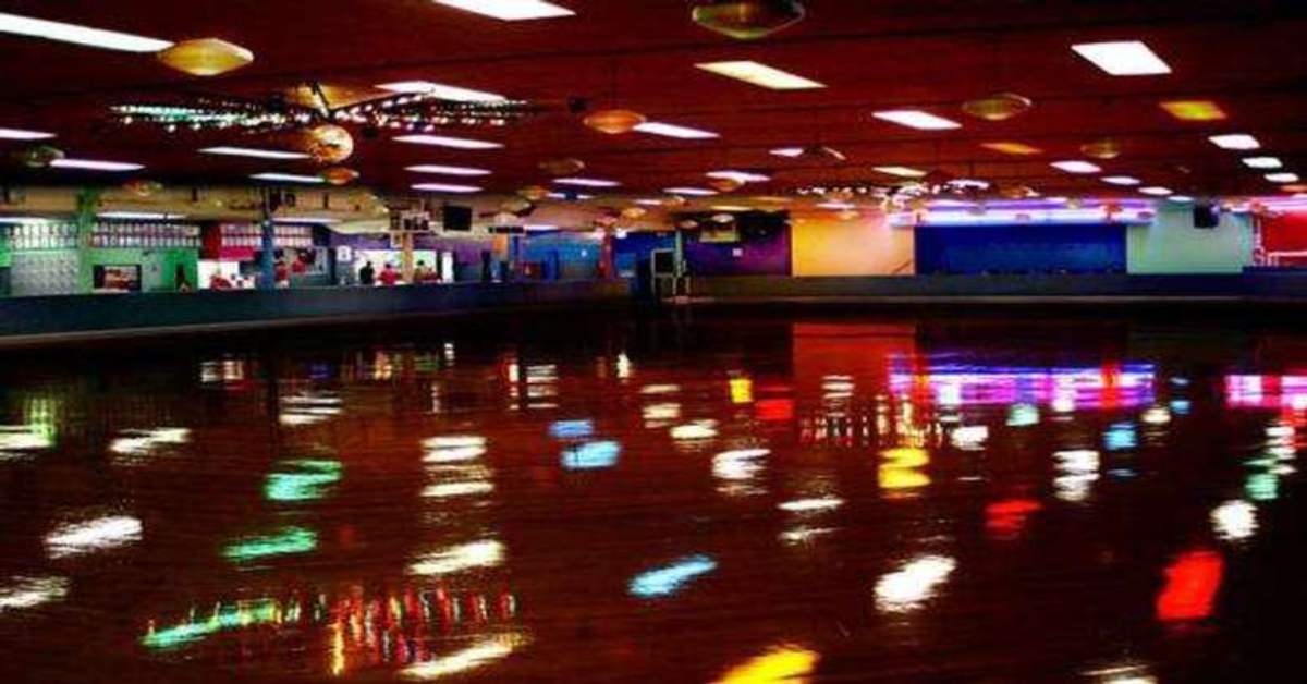 colorful lights shining on an indoor roller blading rink