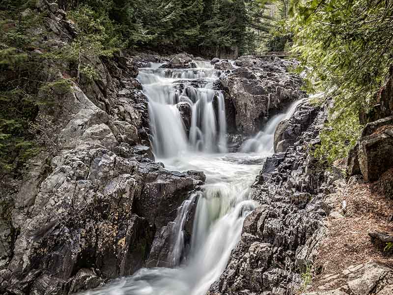 Water flowing over Split Rock Falls near Elizabethtown NY