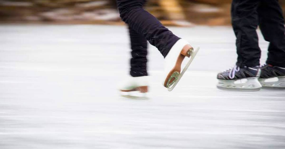 close up of two people ice skating