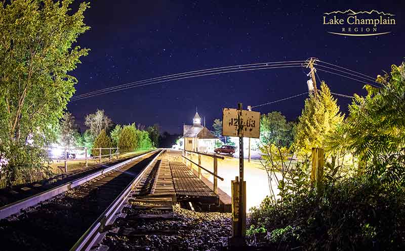 Train tracks at Westport Amtrak Station lit up at night