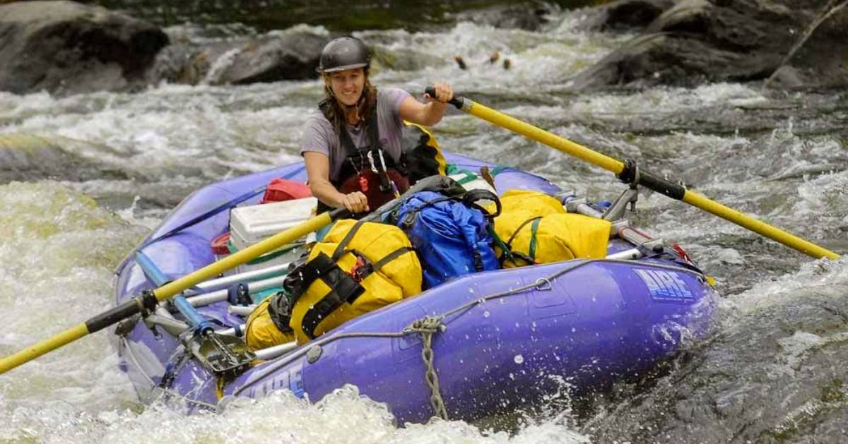 woman whitewater rafting