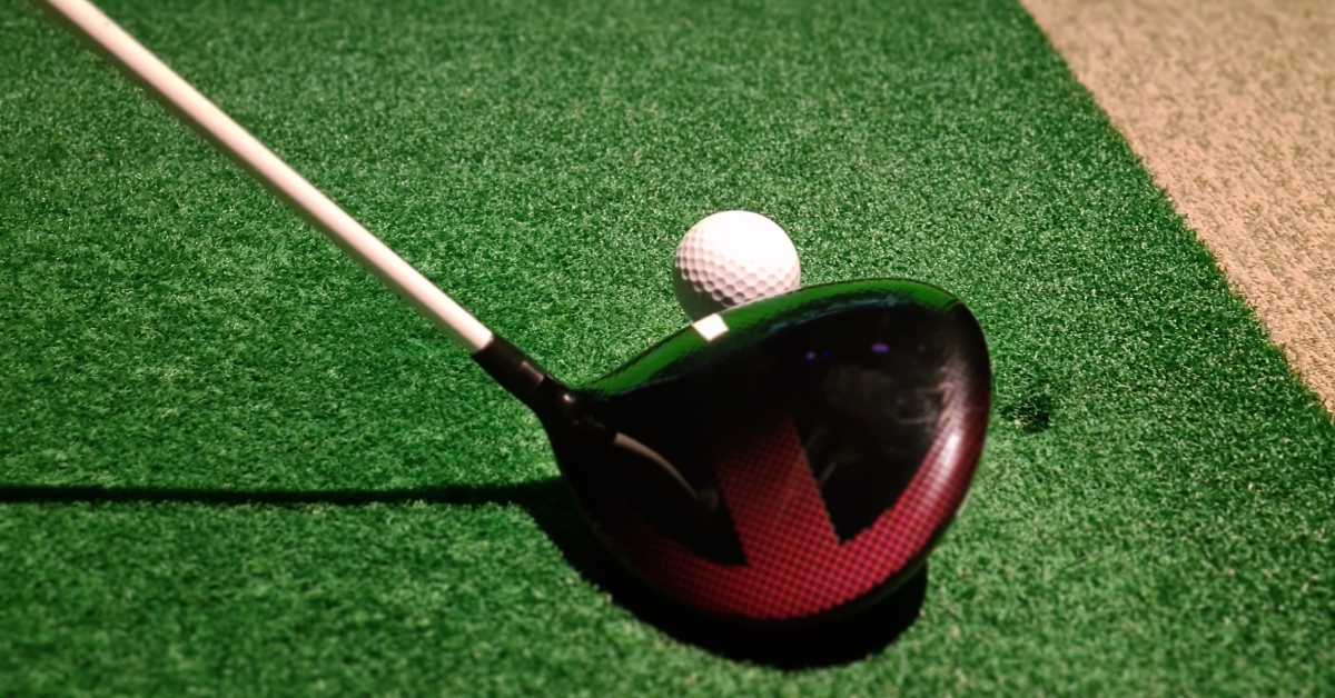 golf club next to a ball