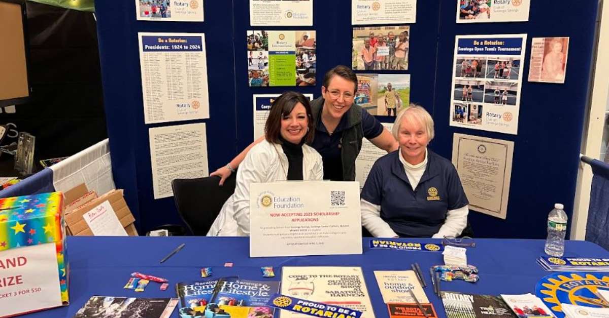 three women at a table for the rotary club