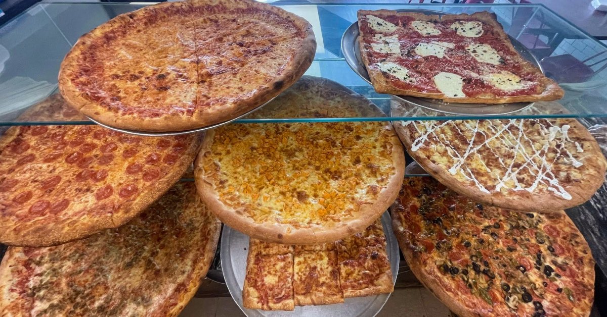 different kinds of pizza on display