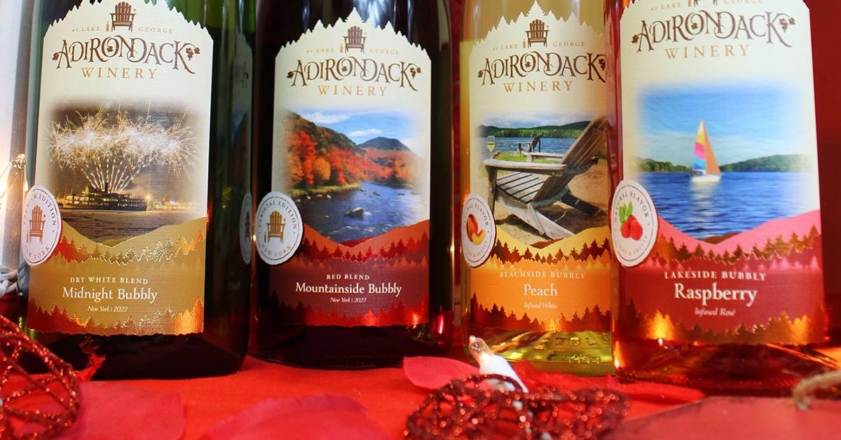 four adirondack winery wine bottles with valentine's day decorations