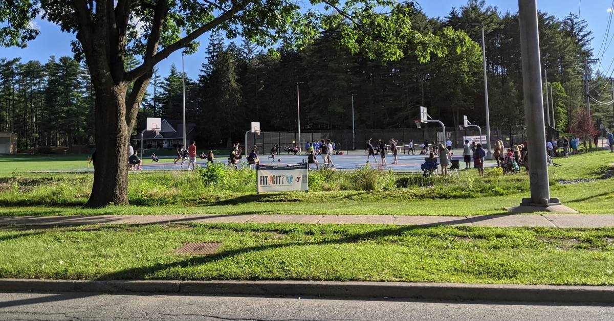 sidewalk going by crandall park's basketball courts