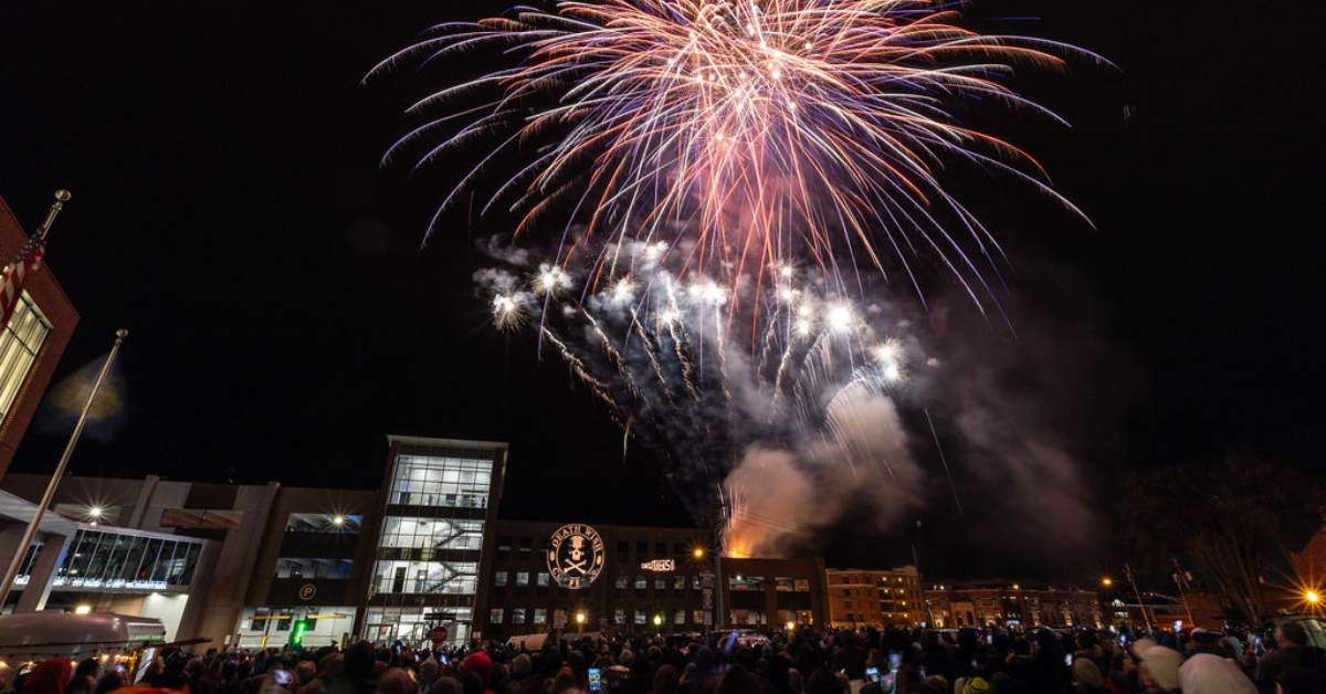 outdoor fireworks show at night above a city