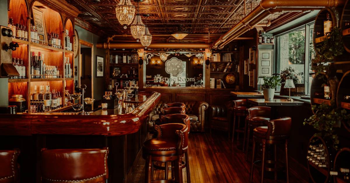 tasting room with a bar and tables along the side