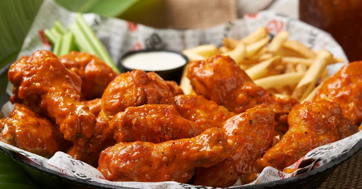 basket of chicken wings and fries