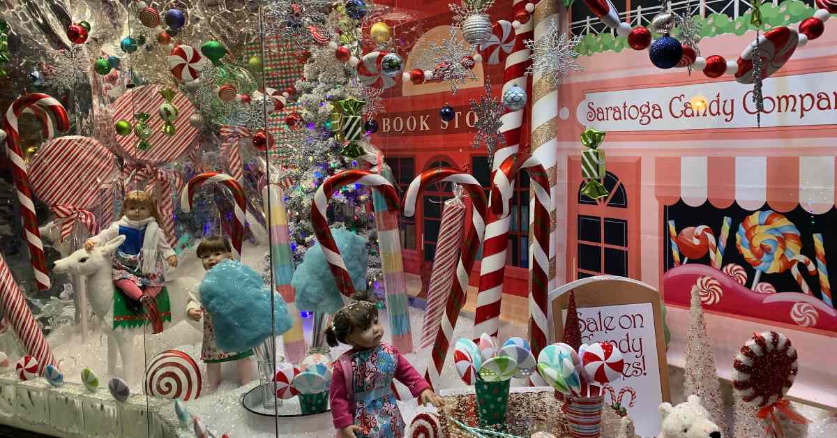 storefront window decorated for Christmas