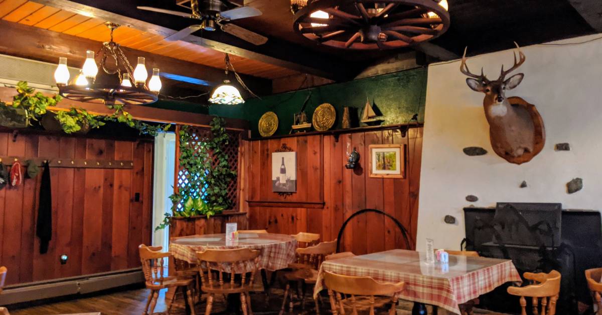 dining room in restaurant with large deer head on wall