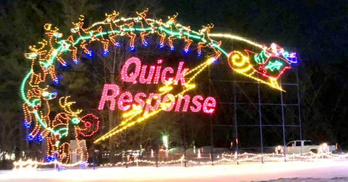 sign for Quick Response decorated with holiday lights