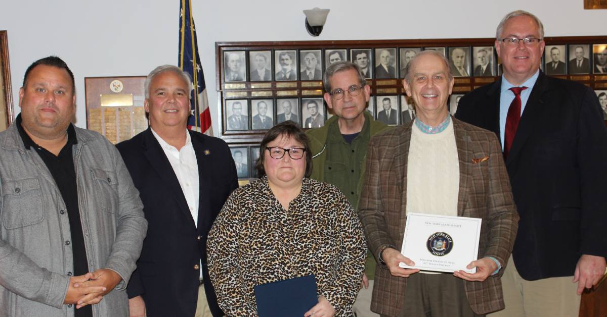 six people pose for awards photo