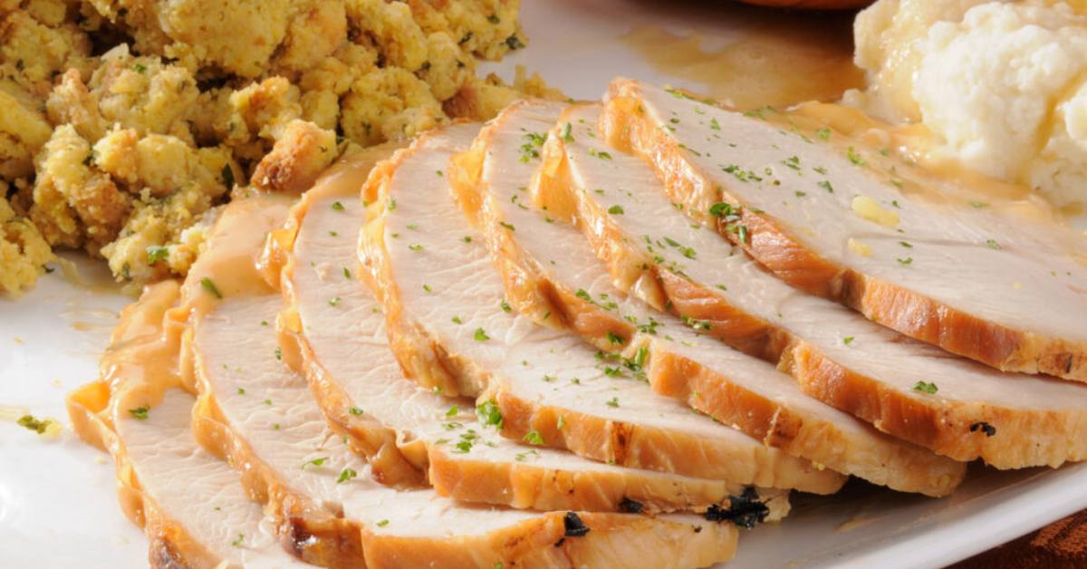 sliced turkey with stuffing and mashed potatoes