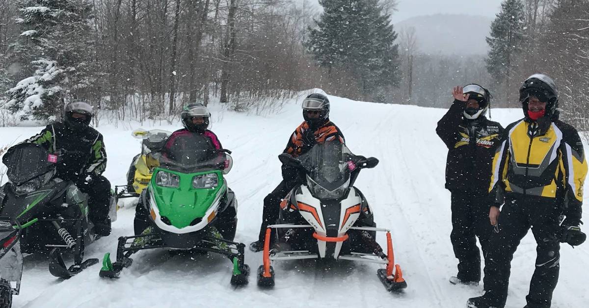 snowmobilers pose