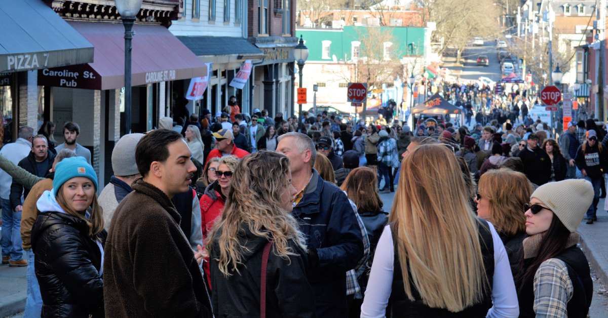 crowd of people walking around downtown