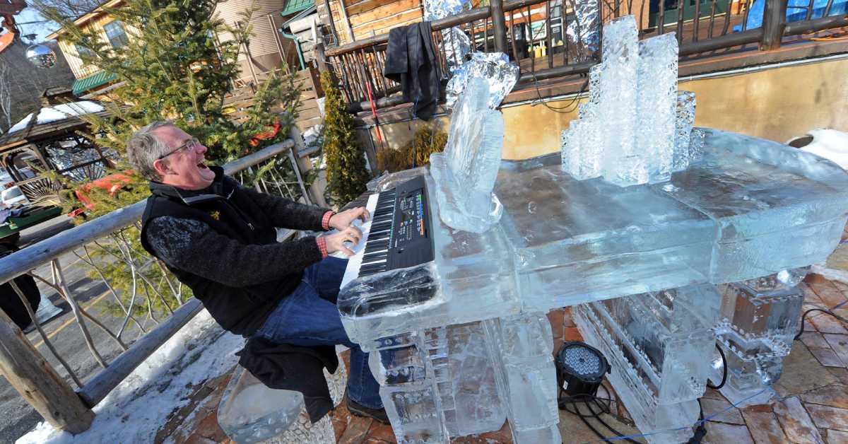 man playing an ice piano