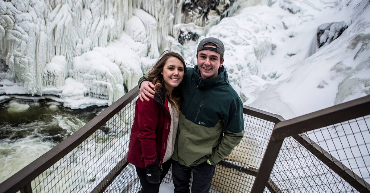 young couple at high falls gorge in winter