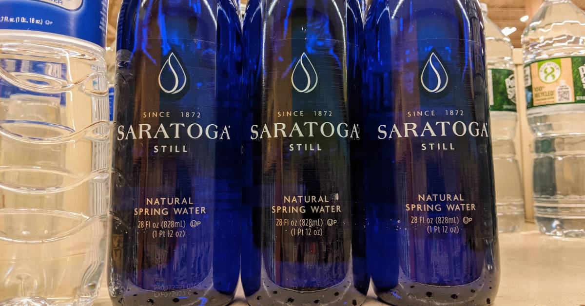 bottled saratoga water on grocery store shelf