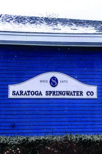 exterior of saratoga springwater building with sign