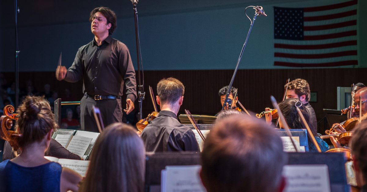 a conductor facing a band