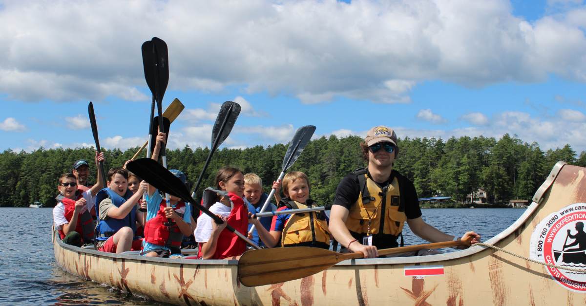 kids in a large canoe