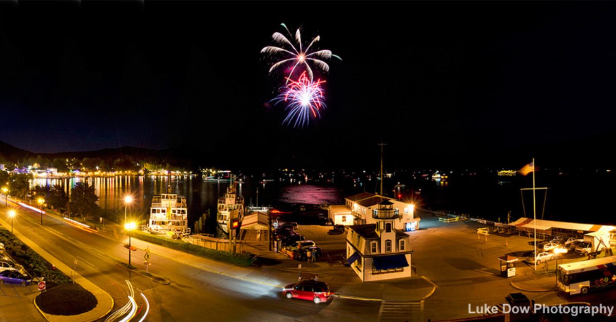 fireworks over a lake at night