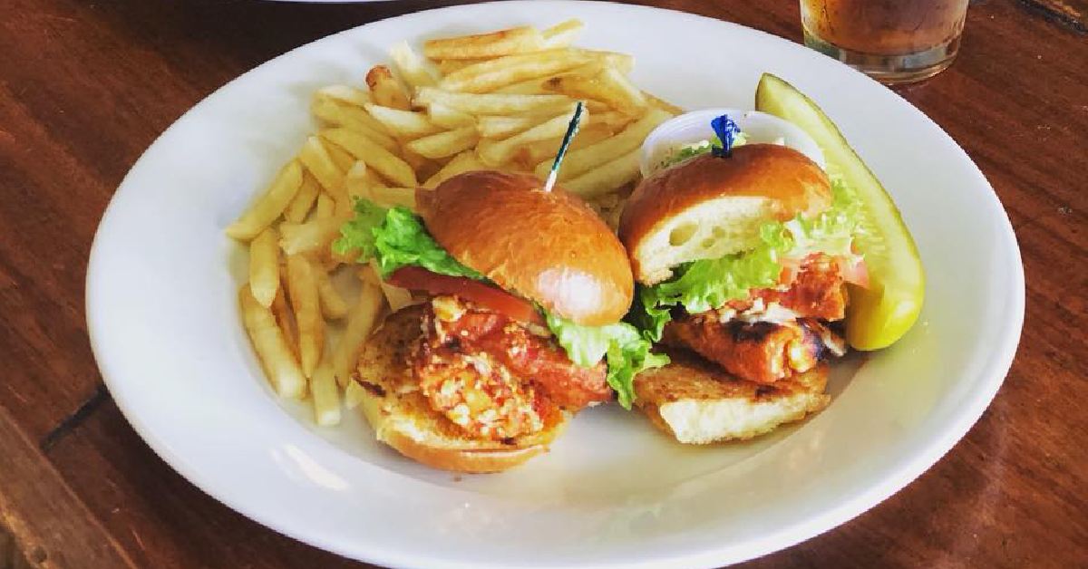 fried fish sliders on a plate.