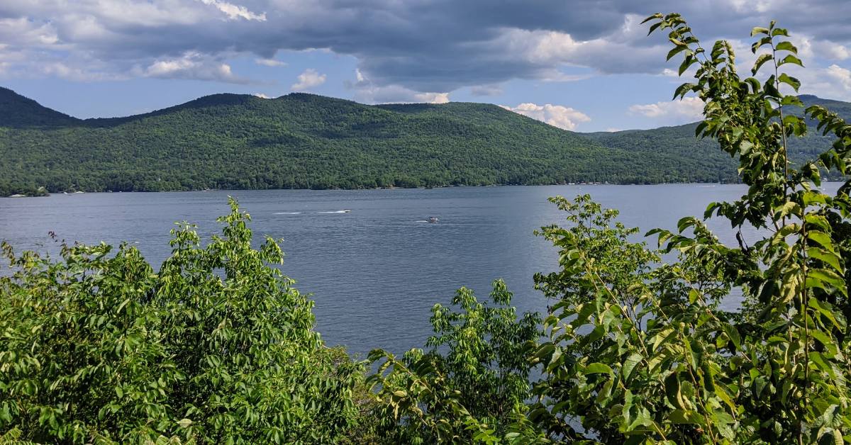 view of lake george looking over trees and foliage
