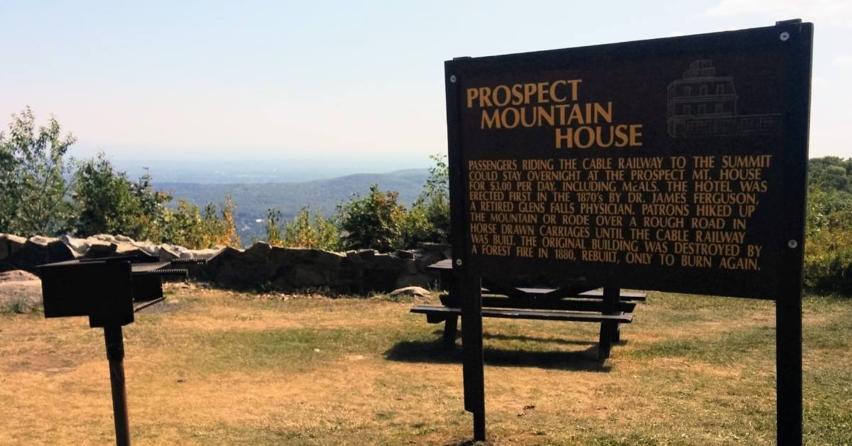 grill and picnic table on mountain next to prospect mountain house sign