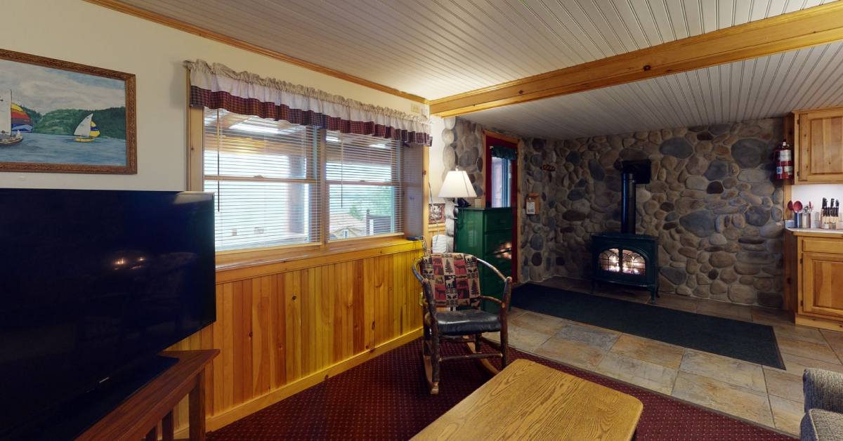 interior of trout house resort cabin with fireplace and tv