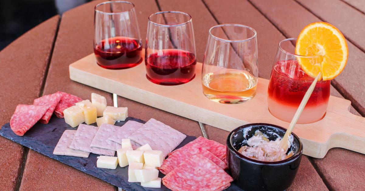 wine flight with small charcuterie board