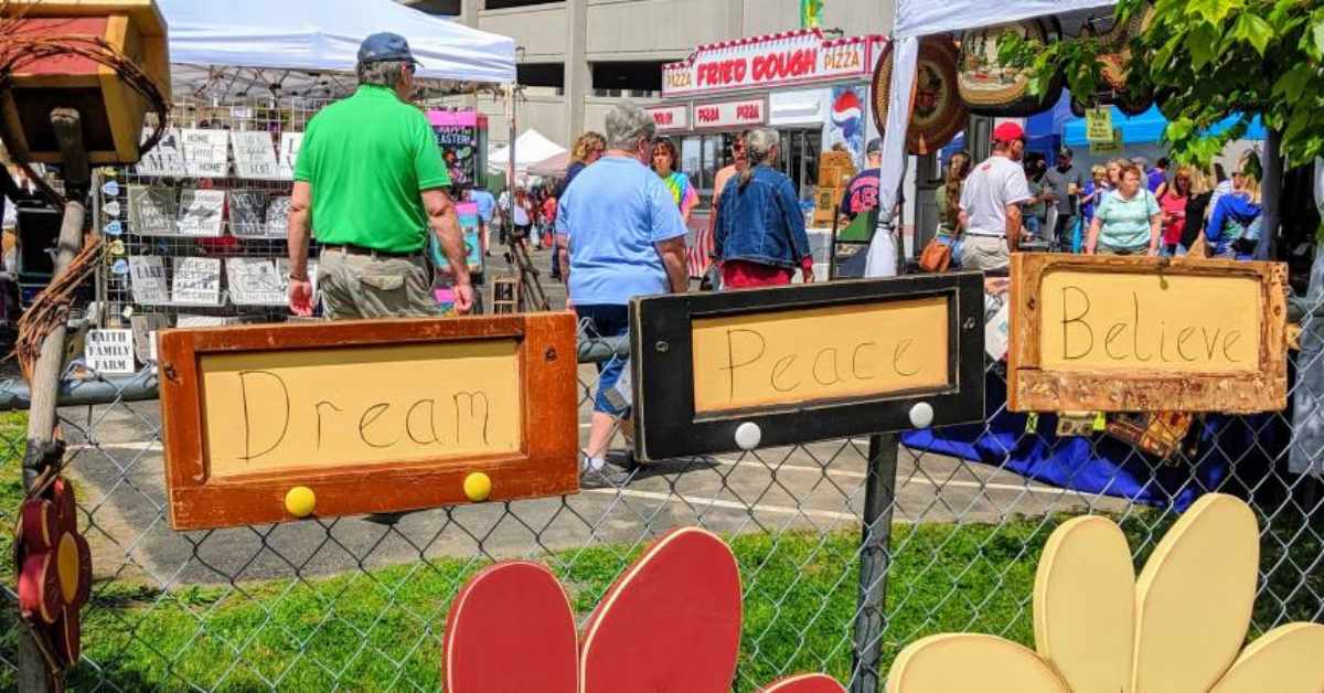 fence and tables at a craft fair
