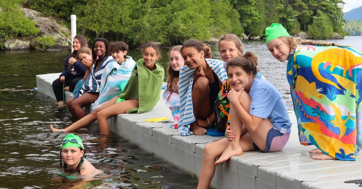 camp kids on a dock