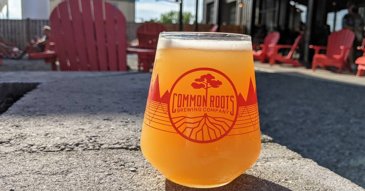 common roots brewing beer glass on their patio