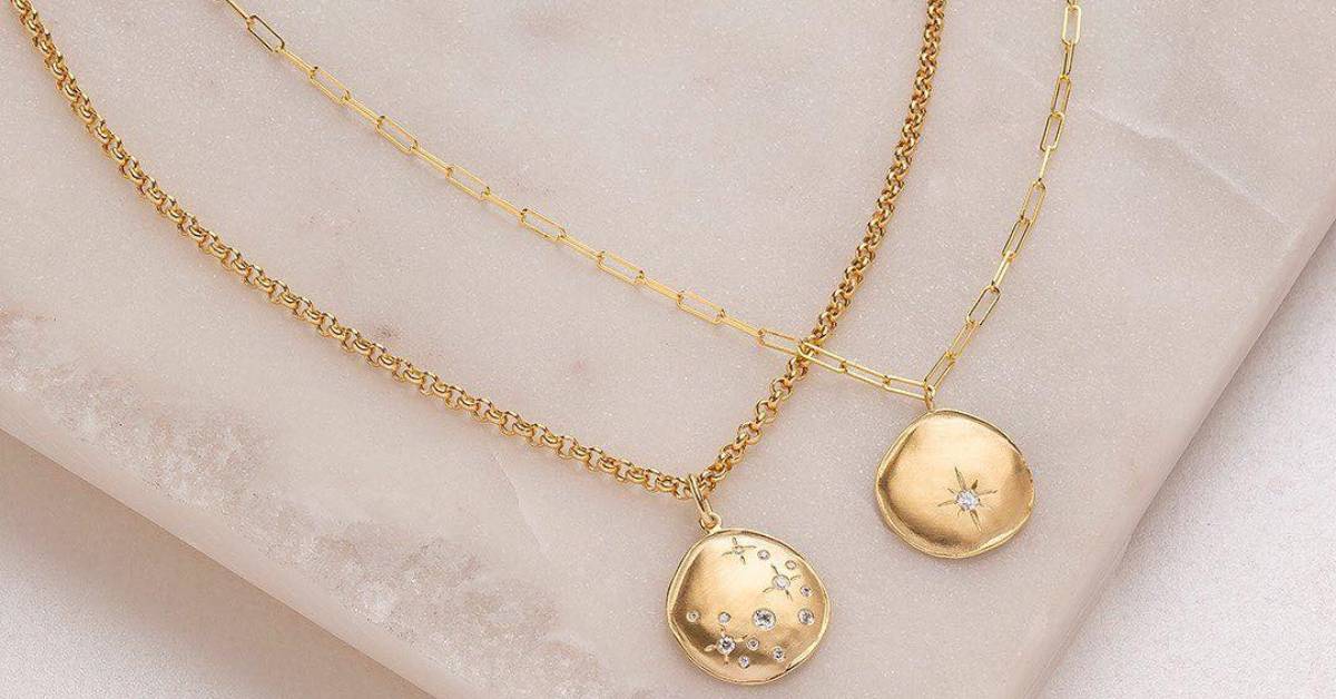 two necklaces with starry symbols