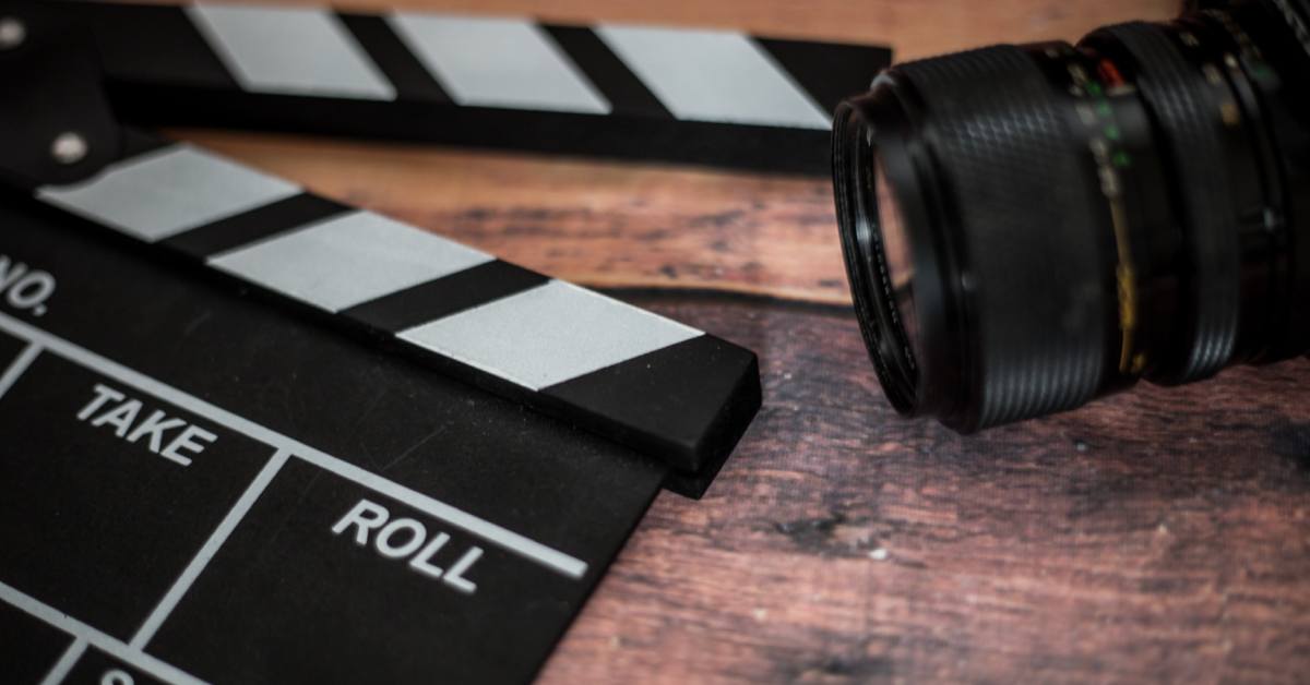 old camera and clapperboard