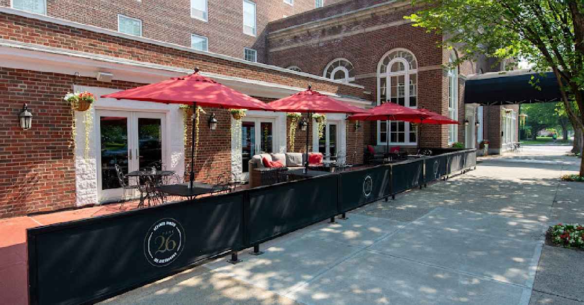 restaurant patio tables with red umbrellas