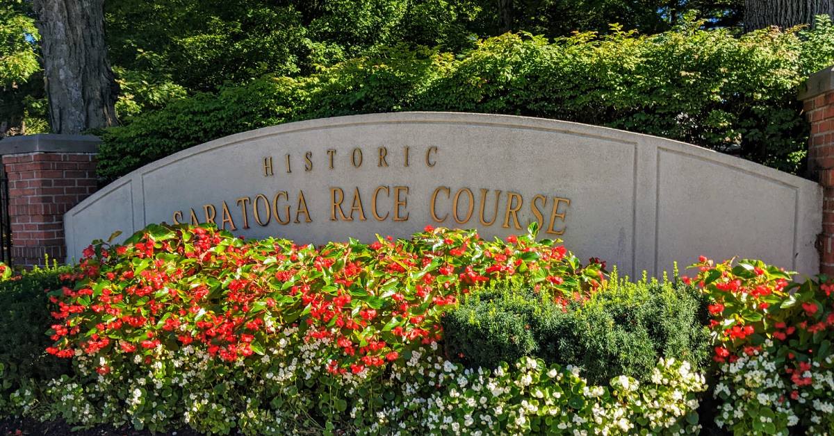 saratoga race course sign with flowers