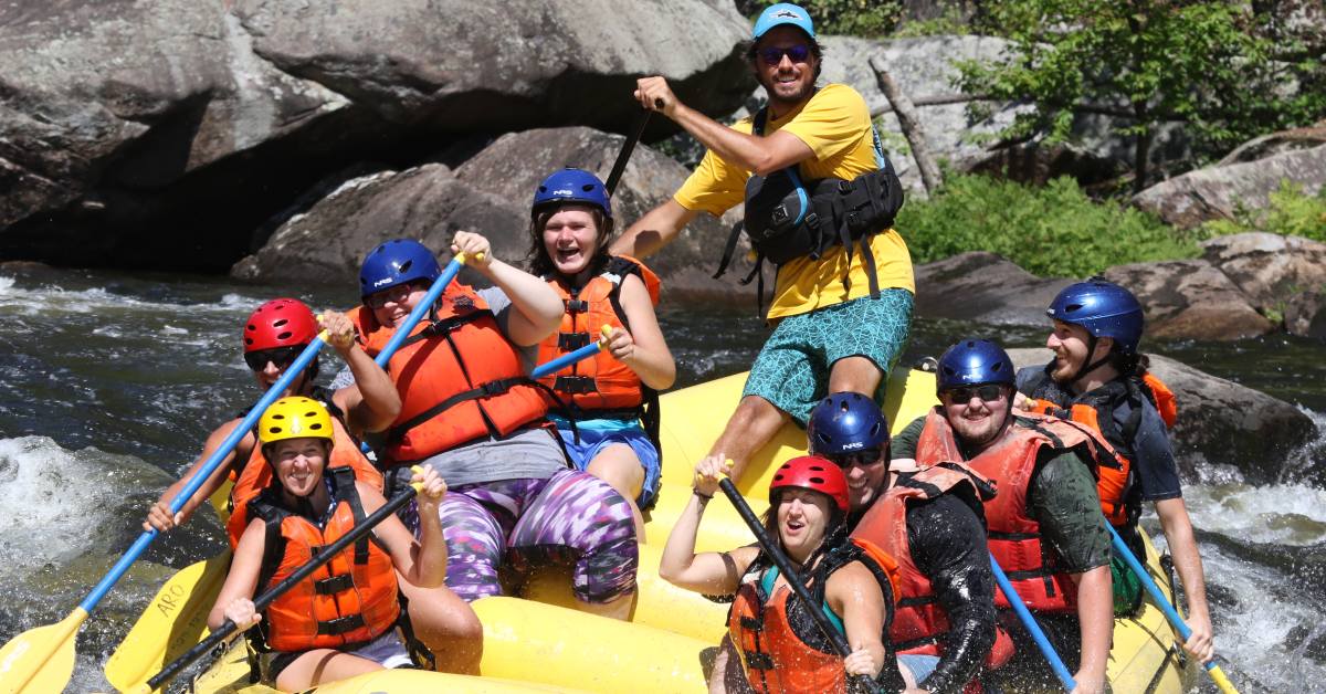 whitewater rafters in the adirondacks on yellow raft