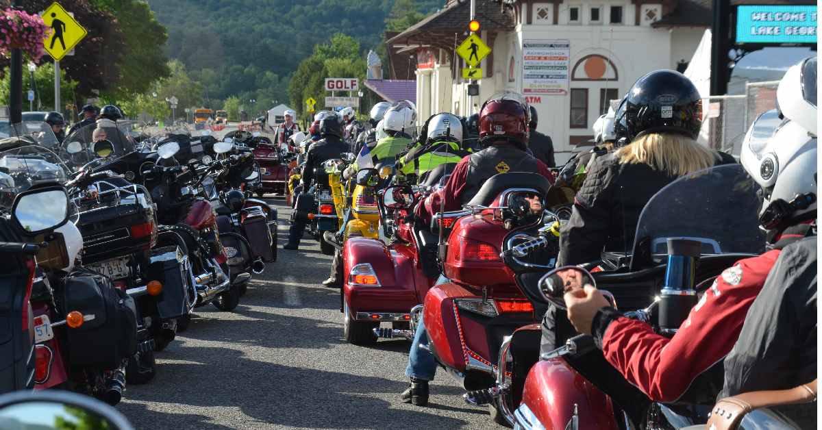 several motorcyles waiting in a line